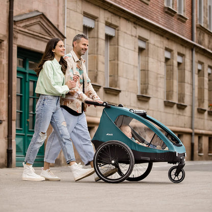 2026 hauck Fahrradanhänger & Kinderwagen Dryk Duo Plus mit Federung, für 2 Kinder (6-48 Monate), inkl. Deichsel, Buggyrad, Fahne und LED Licht, Faltbar, Höhenverstellbar, XL Kofferaum (Dark Green)